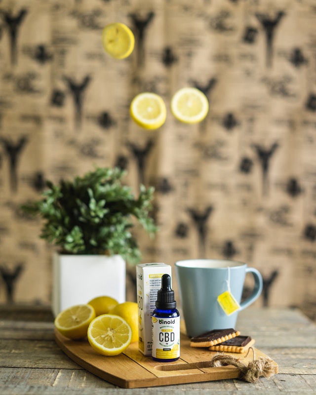 white ceramic mug with sliced lemon beside white ceramic mug 3612193